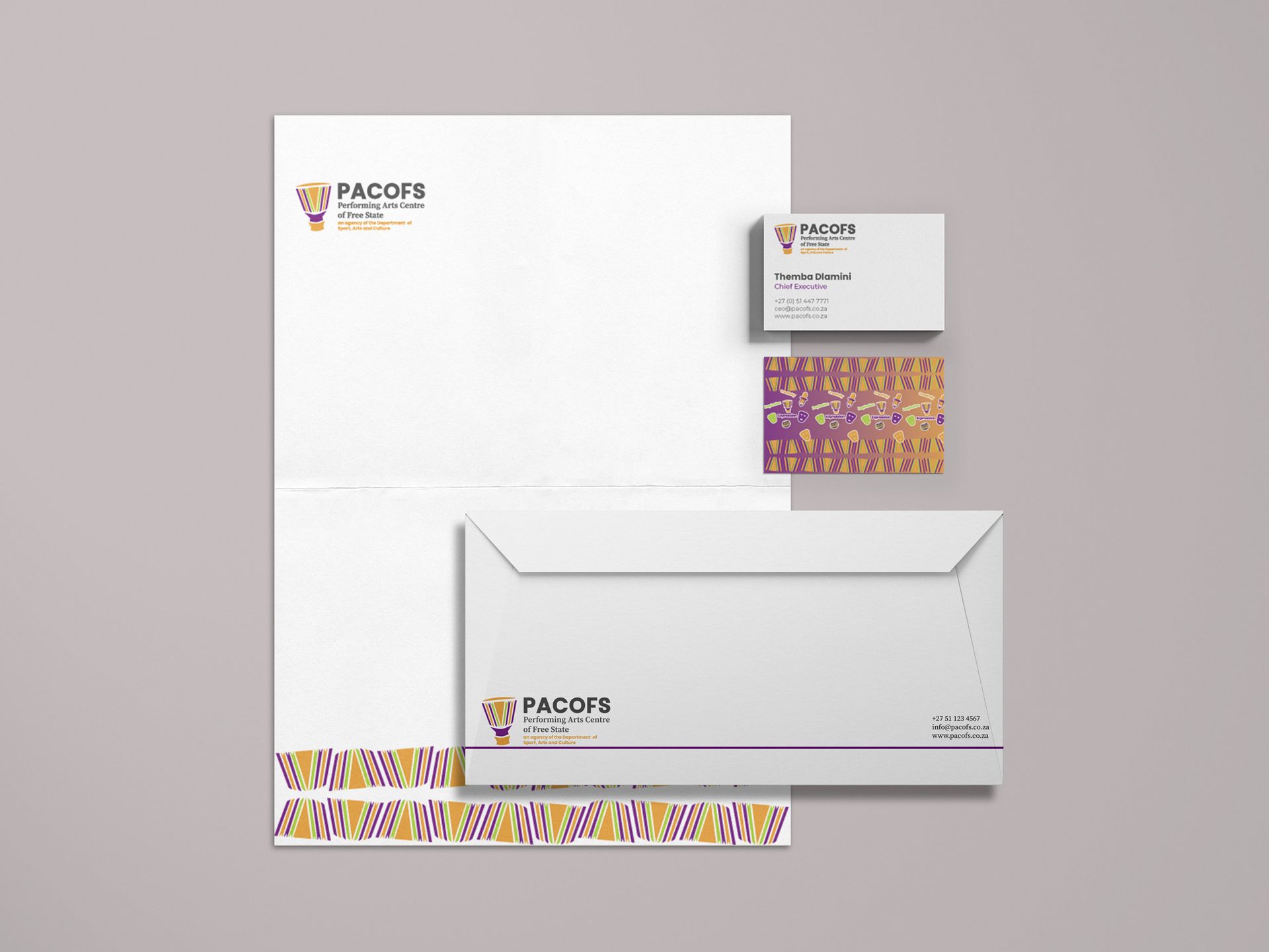 PACOFS brand identity applied to stationery — letterhead, business cards, and envelopes showing the refreshed visual identity