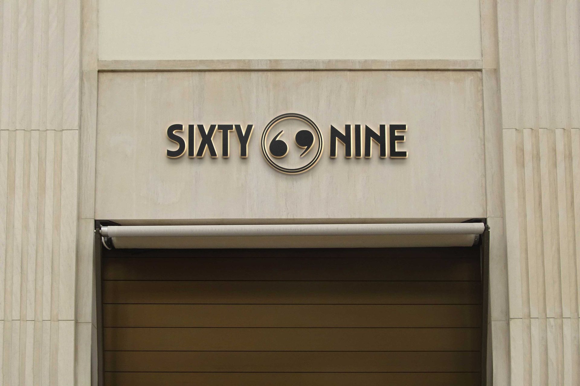 Sixty 9 loading bay signage — branded wayfinding signage applied on site
