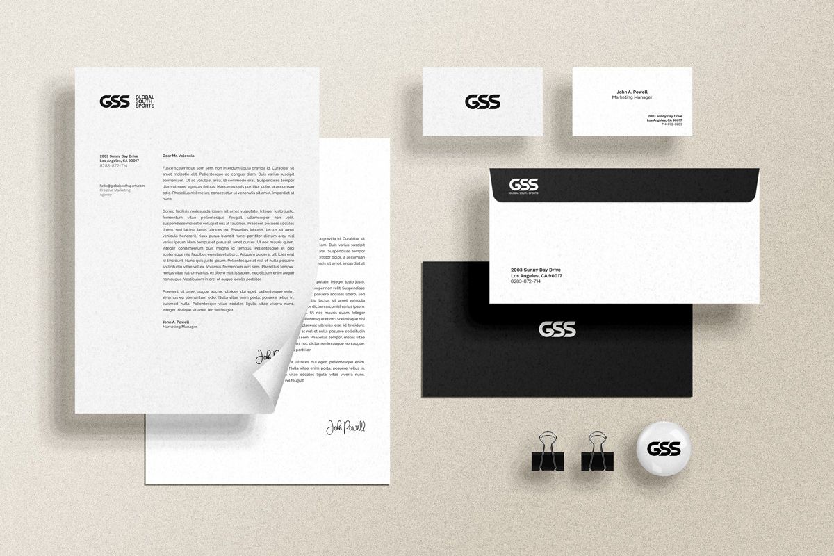 Global South Sports brand identity applied to stationery — letterhead, business cards, envelopes, and branded merchandise laid out on a surface