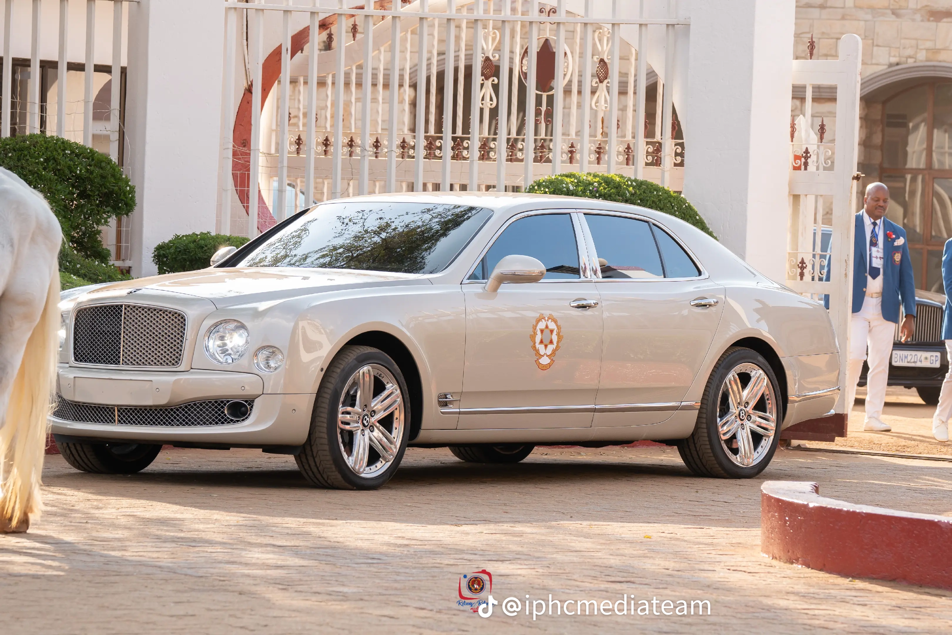 Silver IPHC vehicle with the crest on its front door