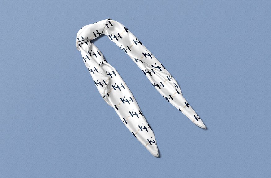 KH Events branded scarf — uniform item carrying the embroidered KH Events identity